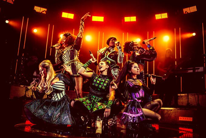 Photo of cast of SIX which extends at Arts Theatre